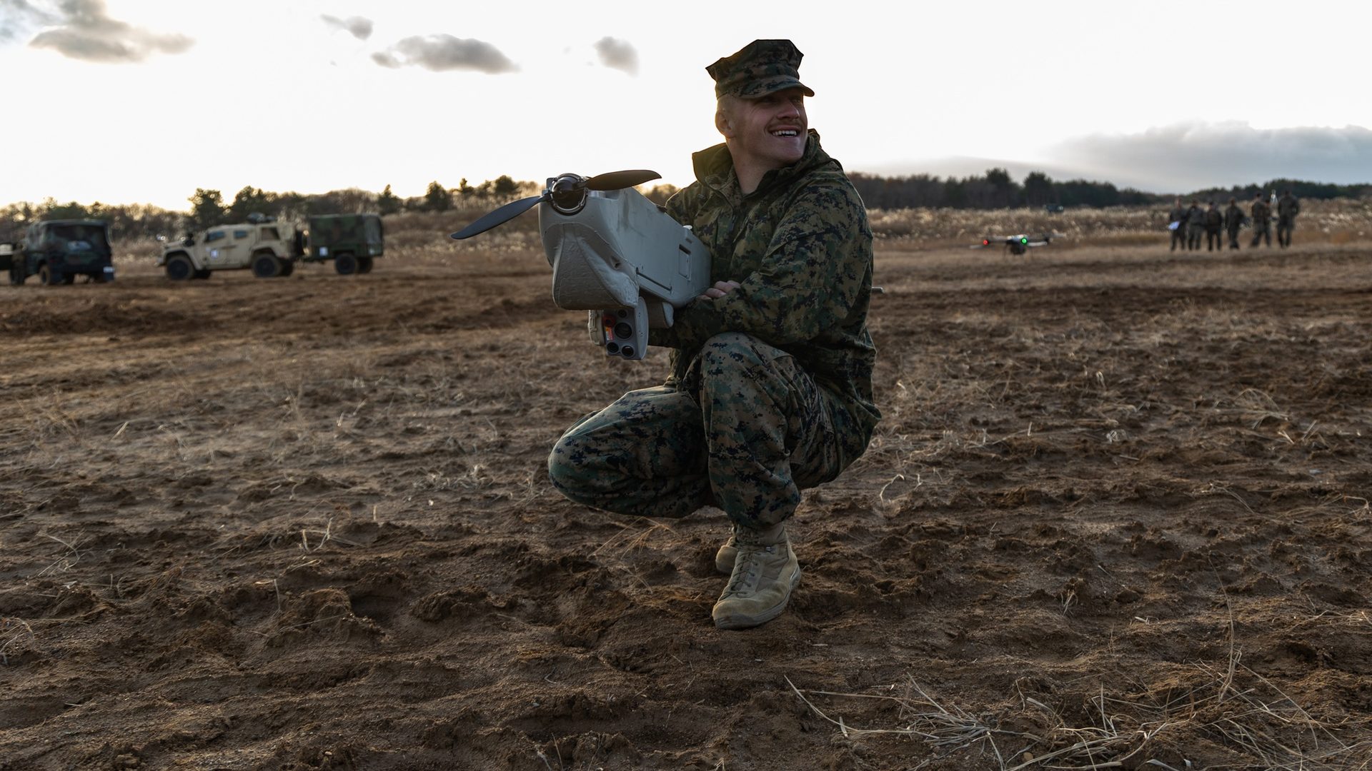 Service member with small UAS in field deployment